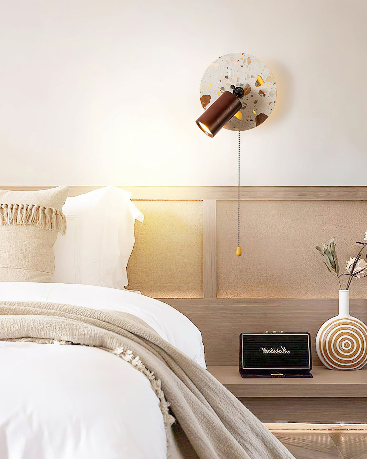 The Swizzle Wall Lamp shown from a side angle to display its depth.