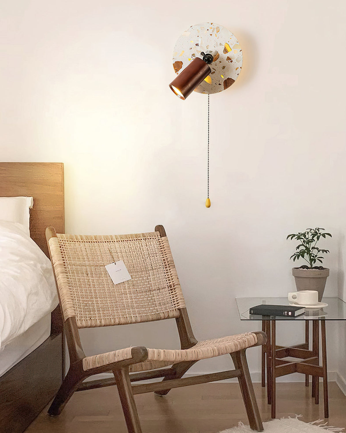 Unlit view of the Swizzle Wall Lamp against a neutral wall.
