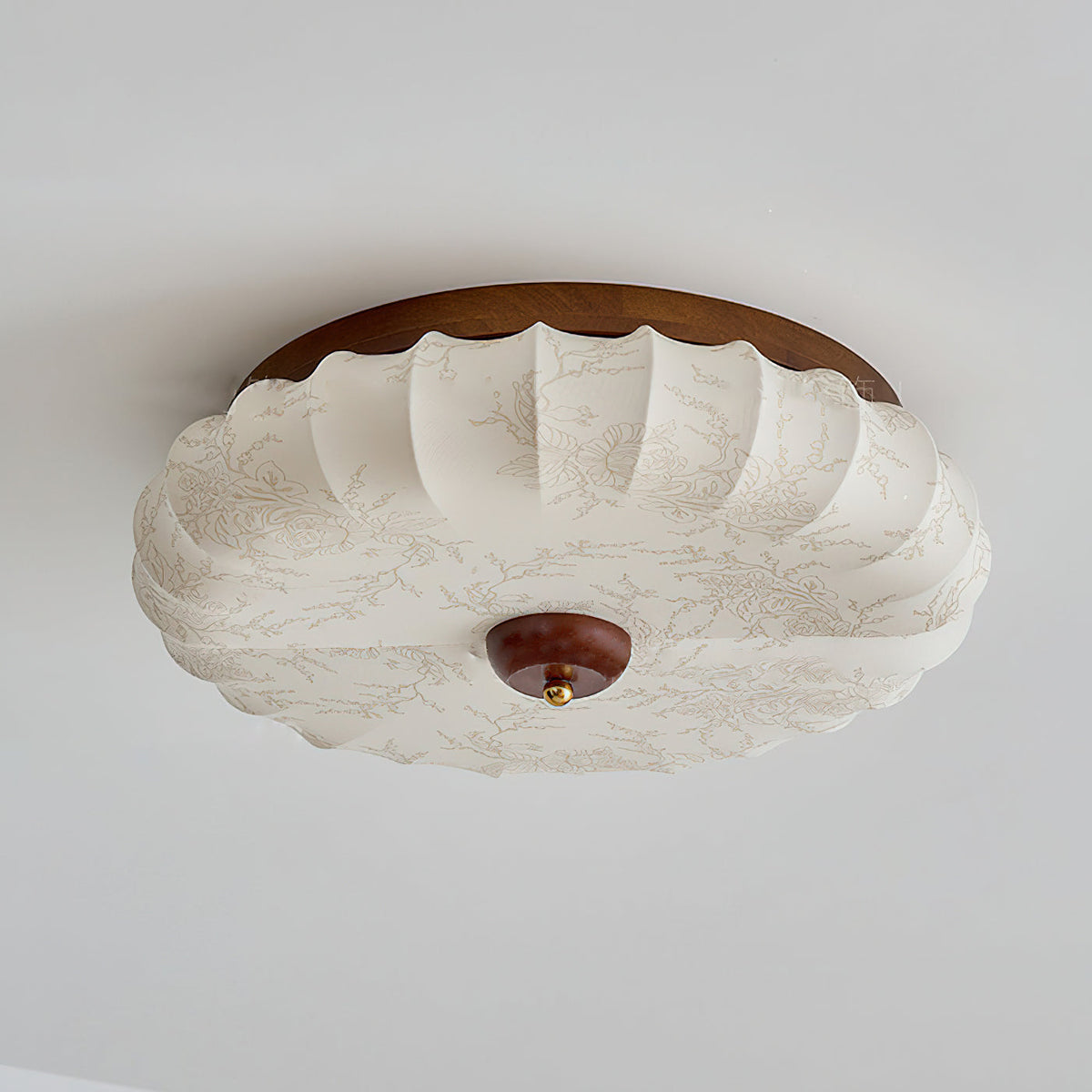 The flush mount casting a soft, glare-free light in a room.