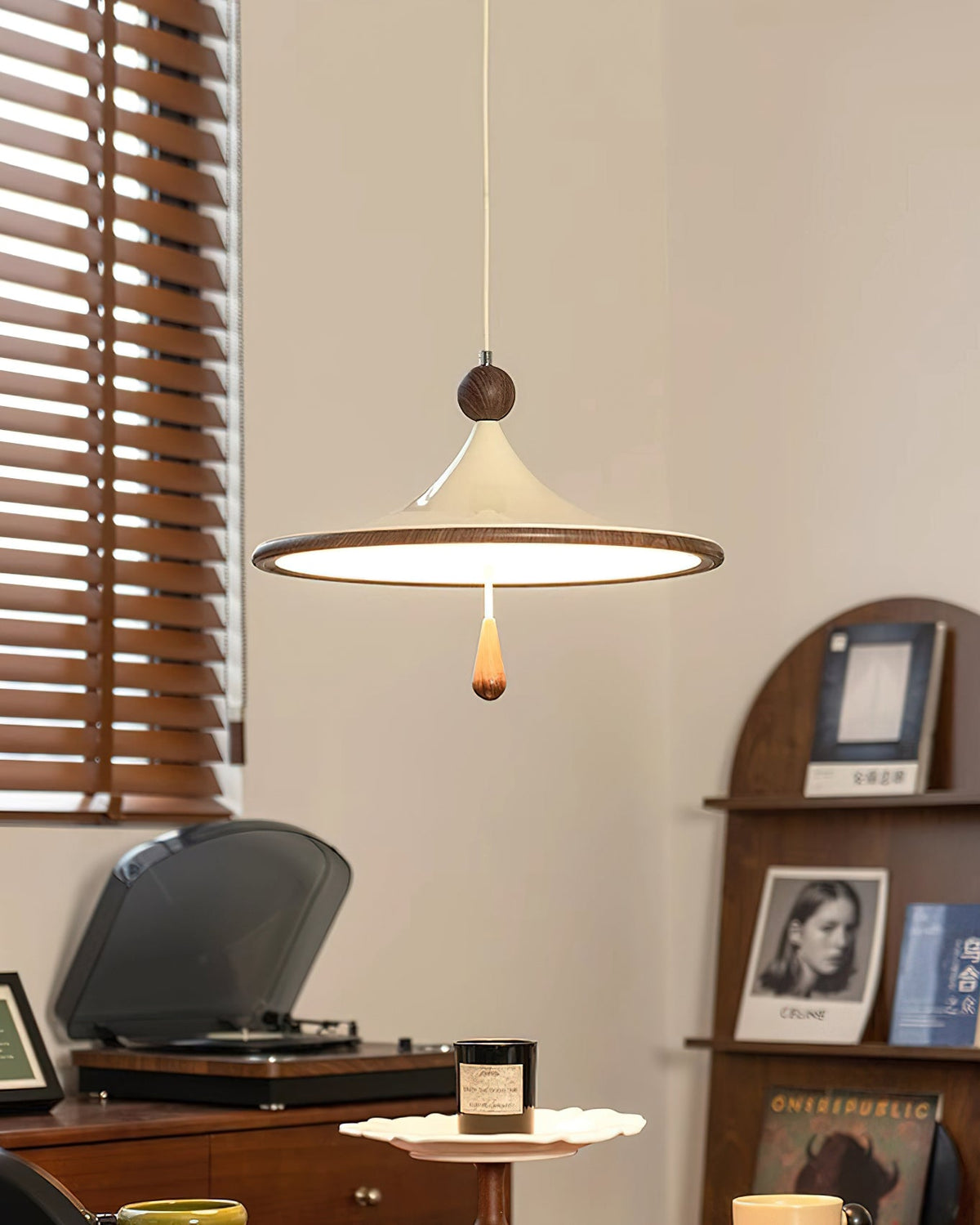 The Tomaso Pendant Light illuminated, casting a warm and inviting glow.