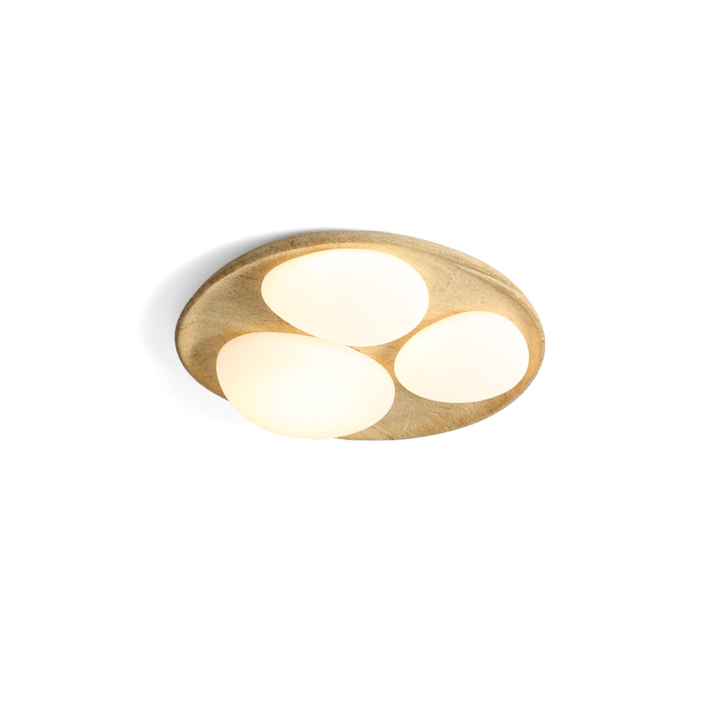 Topo Ceiling Light in a beige stone finish, viewed from the side.