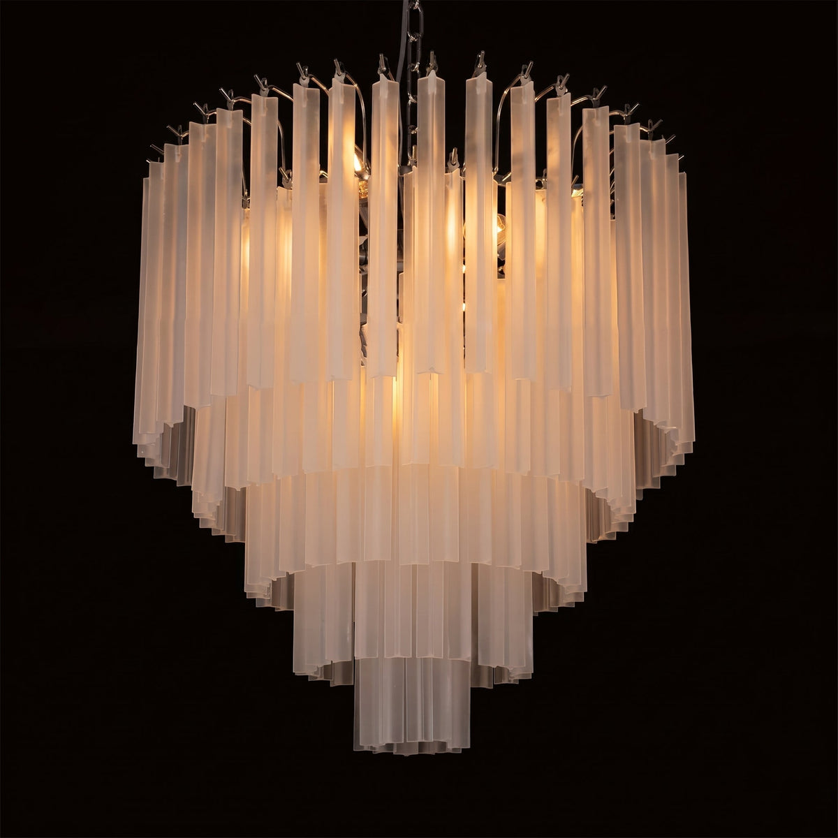 The 50cm Triedra Cascade Chandelier in a living room setting.