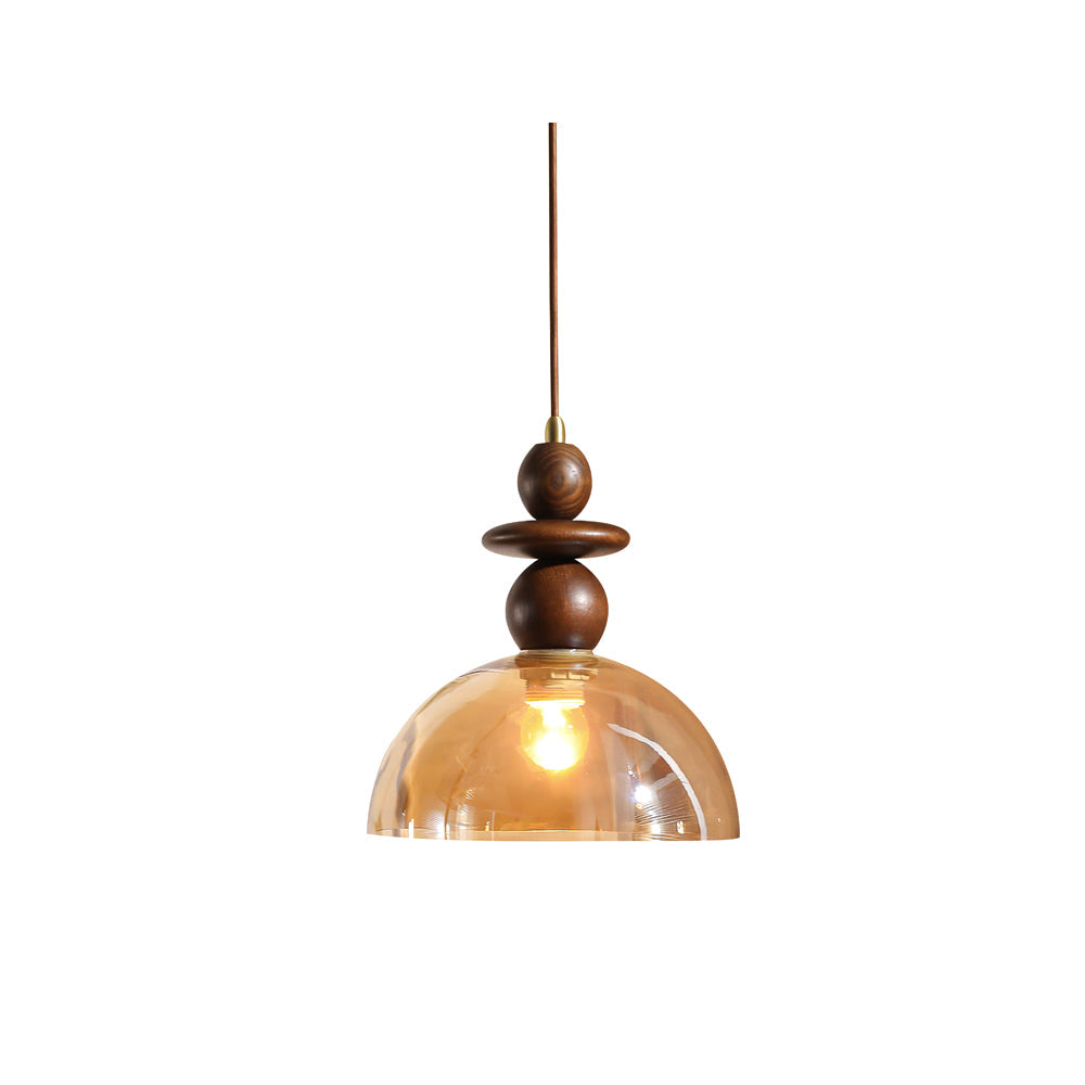 Valeska Pendant Light with amber glass dome and wood accents.