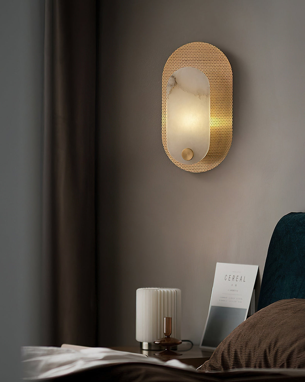 Detail of the gold finish on the metal fixture of the Vance Wall Lamp.