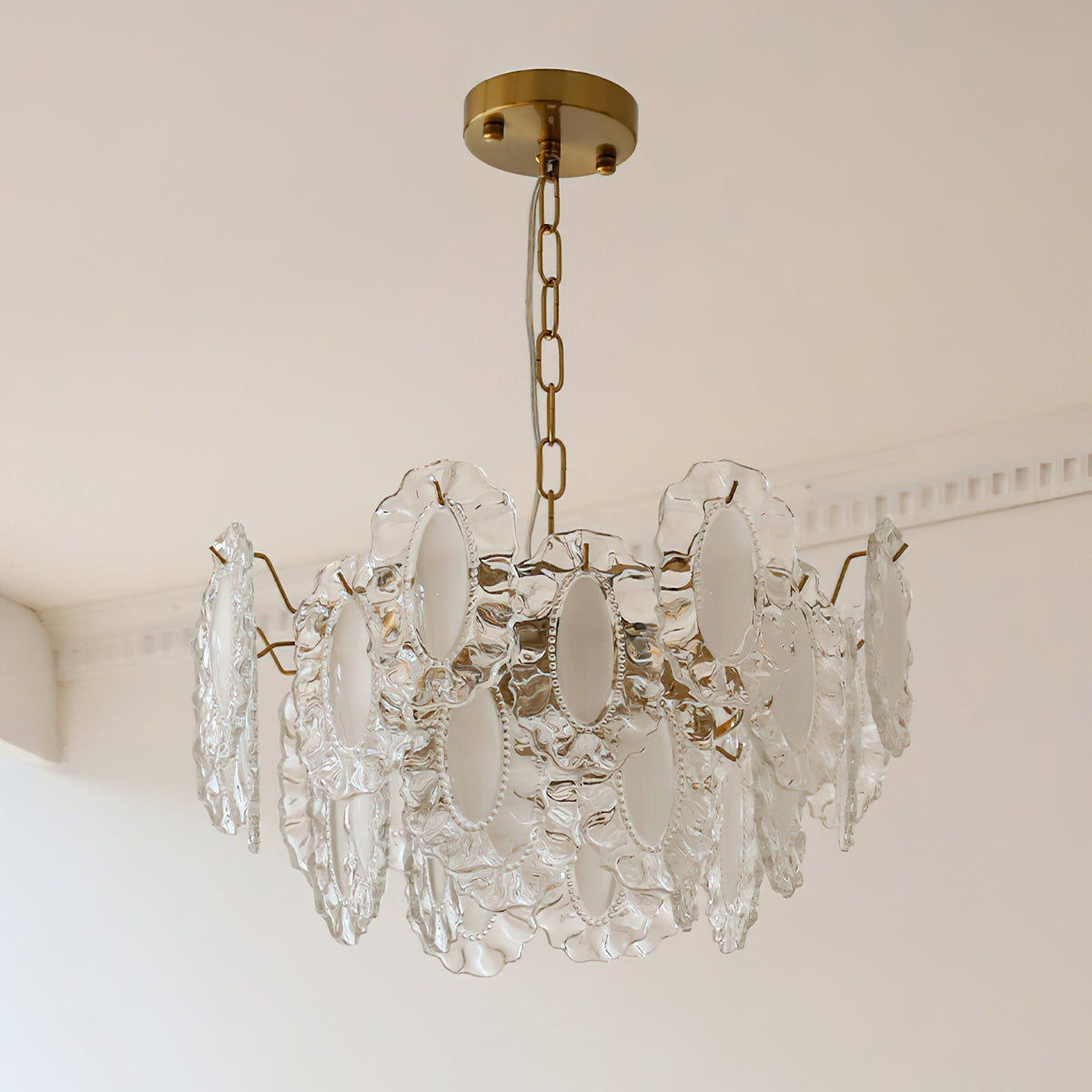 Detail shot of the warm gold metal framework of the Varvara Chandelier.