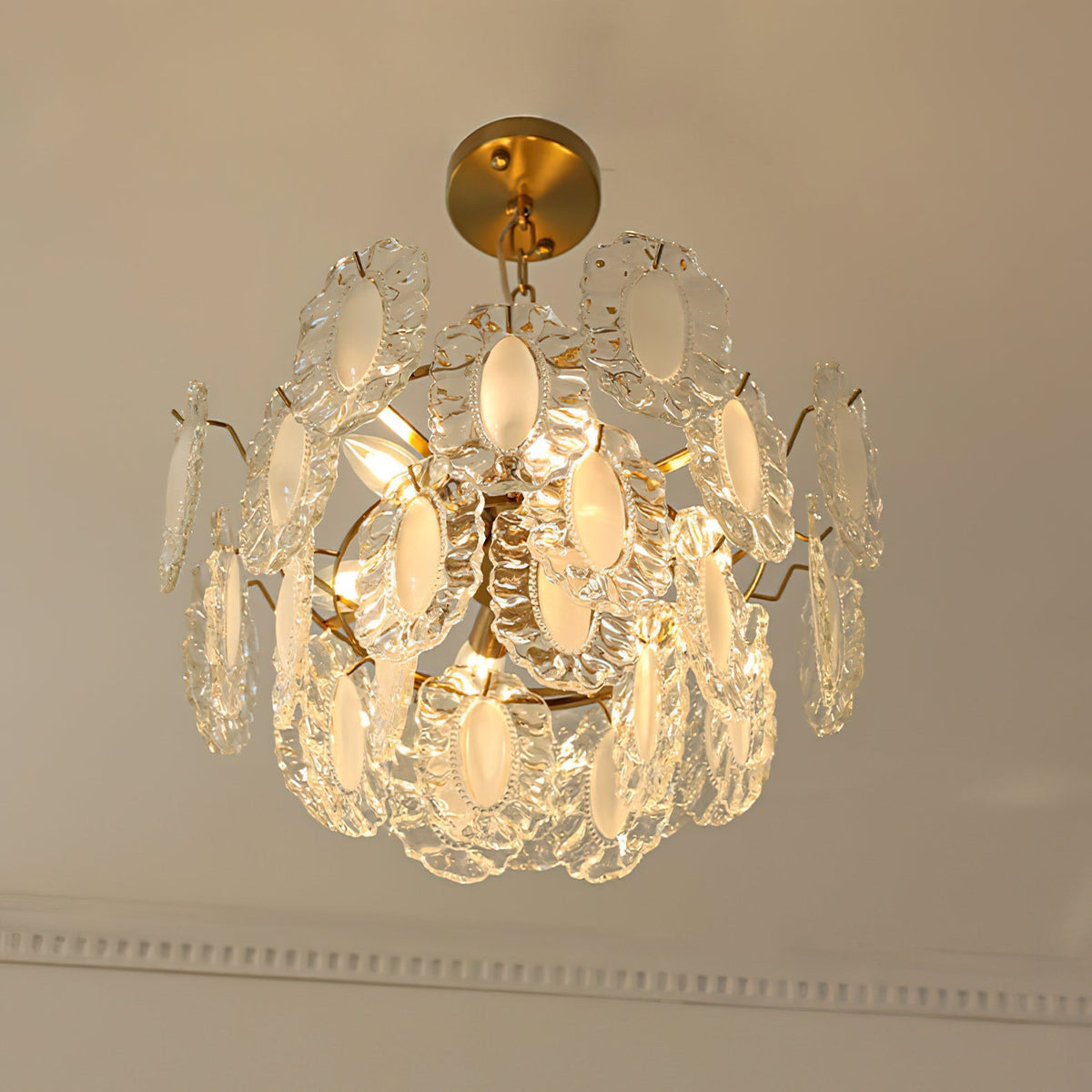 The Varvara Chandelier hanging in a modern living room setting.