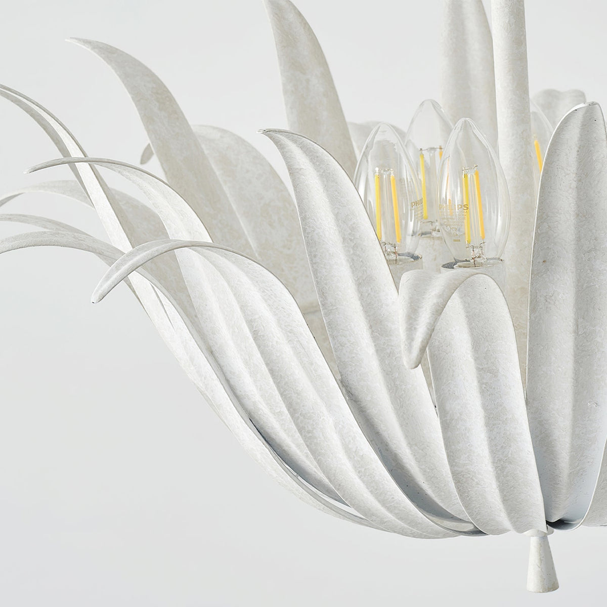 The light fixture casting a warm and inviting glow in an entryway.