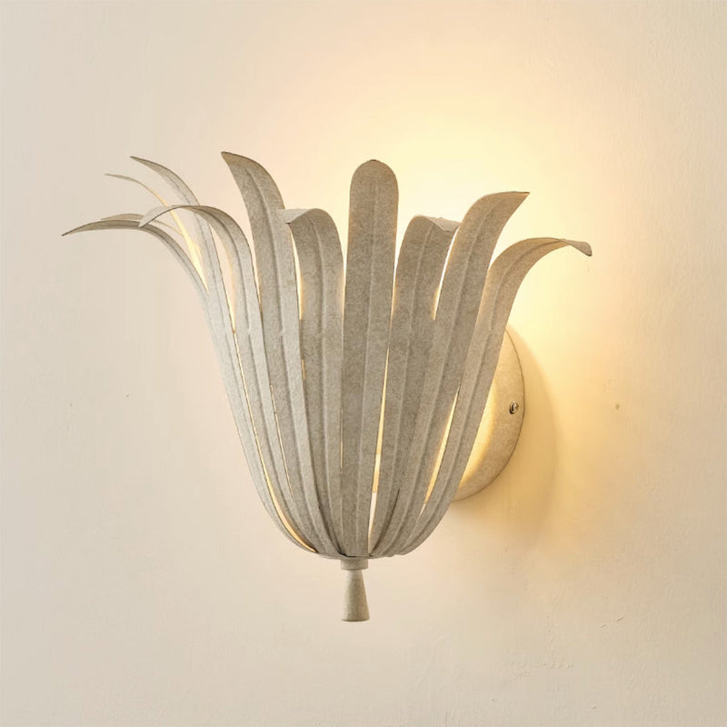 Angled view of the gold Vicenzio Leaf Wall Lamp showing its depth.