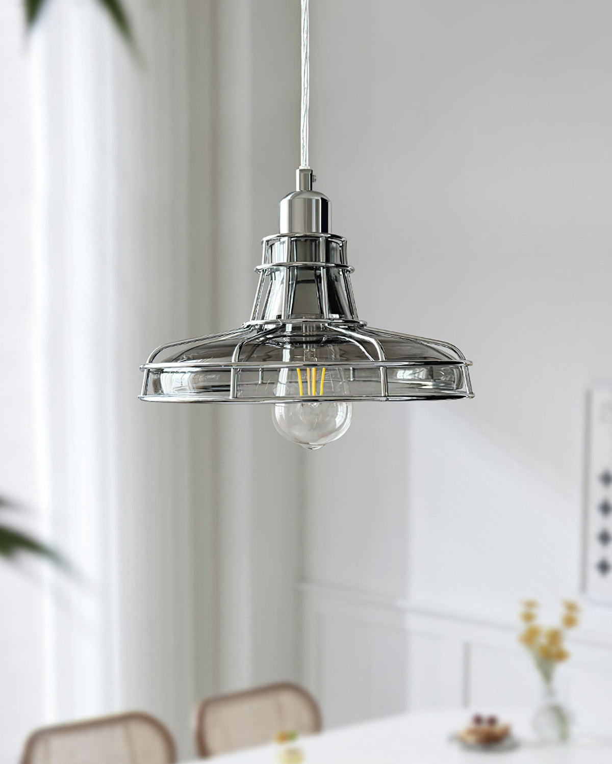 Williston Pendant Light shown illuminated in a modern kitchen setting.