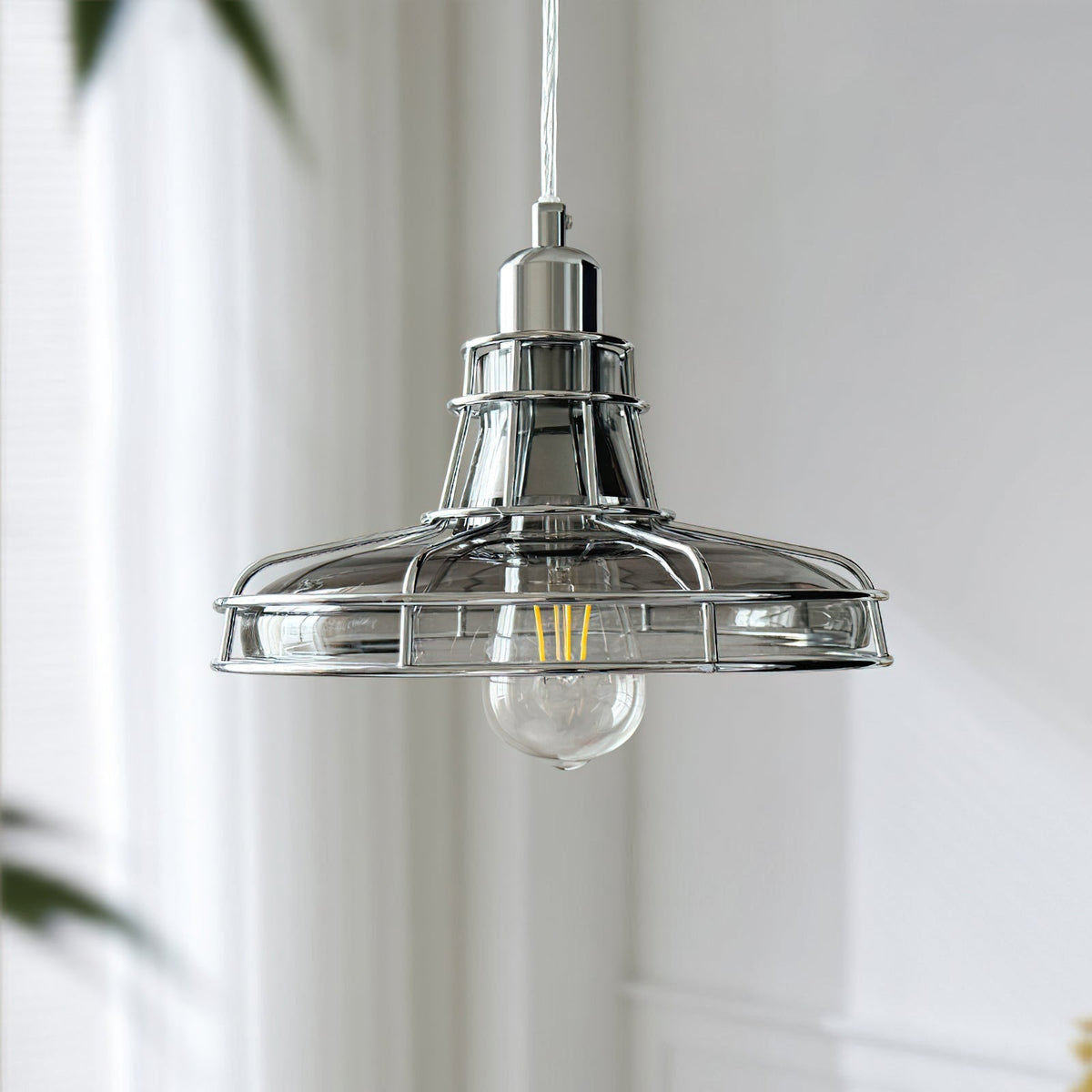 Close-up view of the Williston Pendant Light's metal and glass construction.