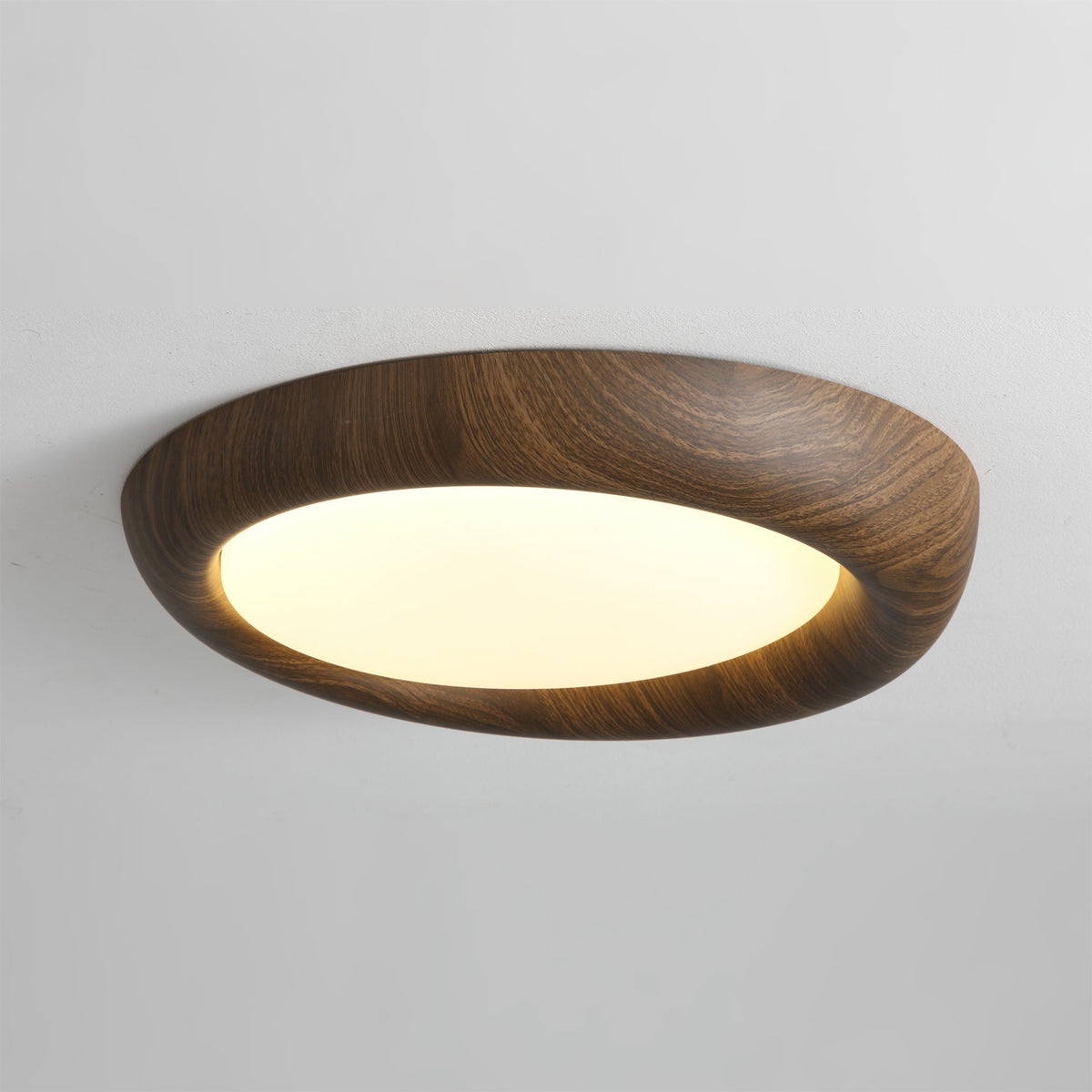 The Vikaey Ceiling Light shown in a bedroom with minimalist decor.