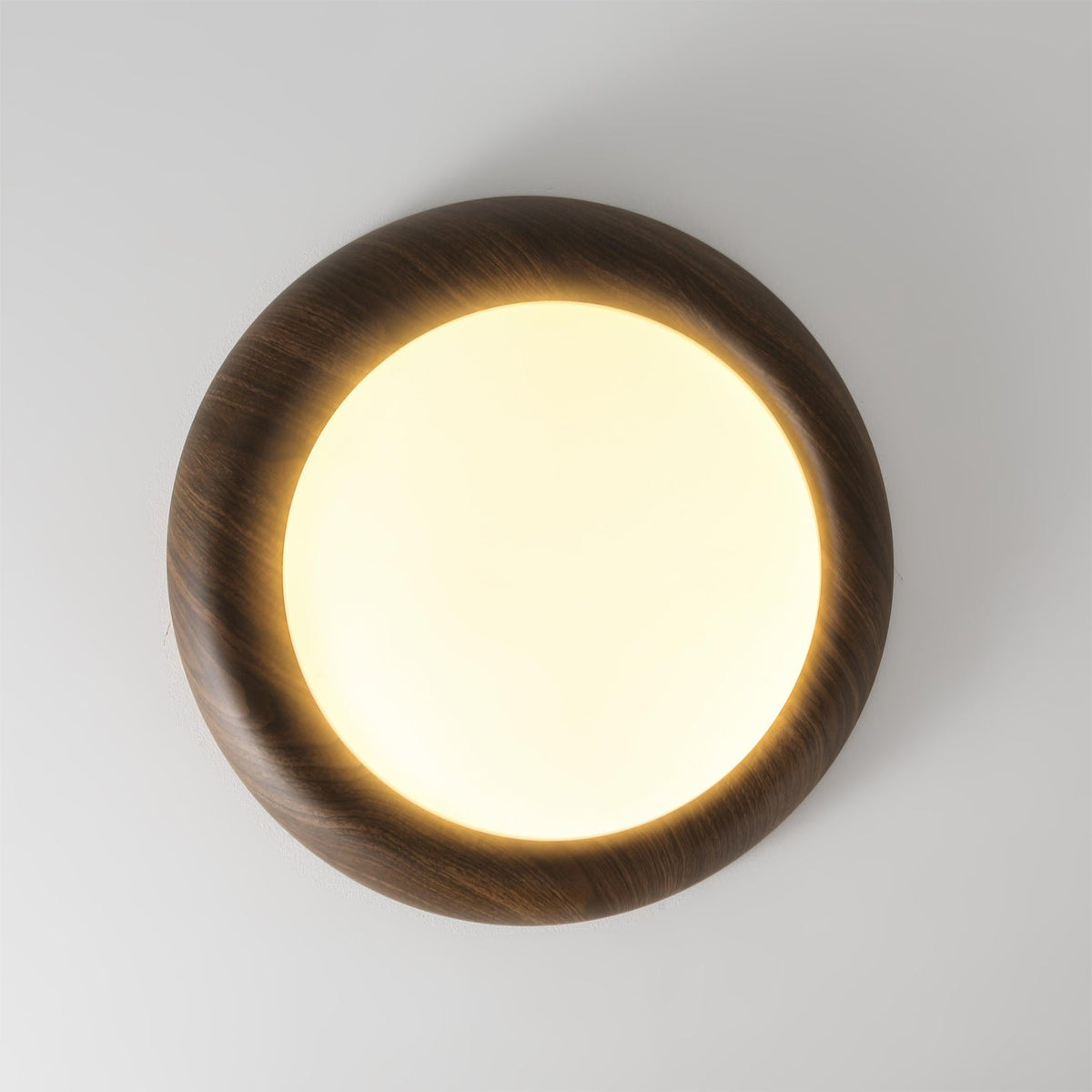 Vikaey Ceiling Light illuminating a contemporary dining area.