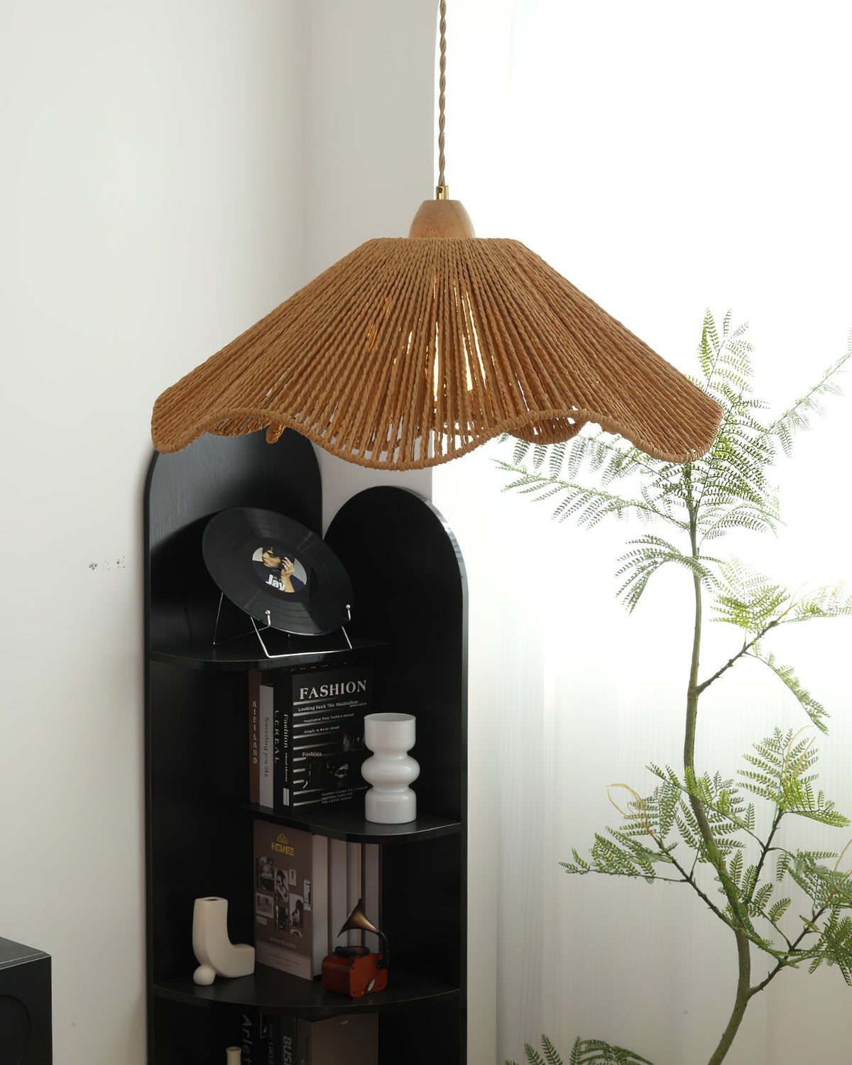 The Vilna Pendant Light hanging over a modern dining table.