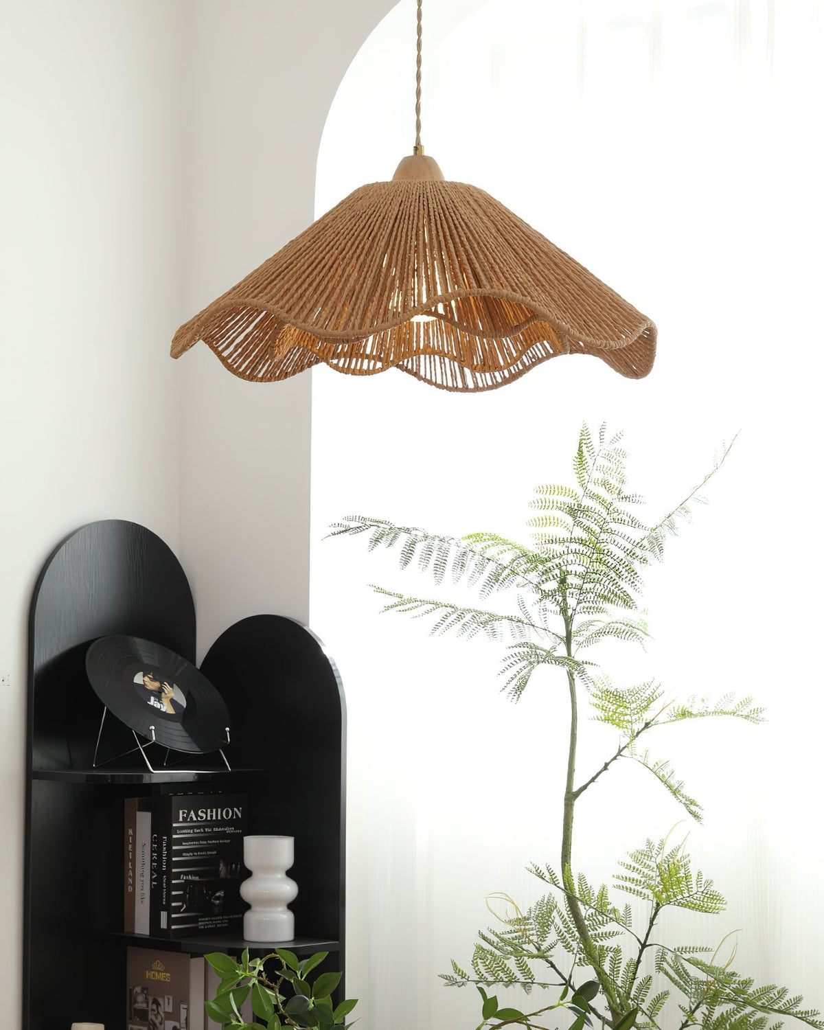 The natural rattan color and texture of the Vilna Pendant Light shade.