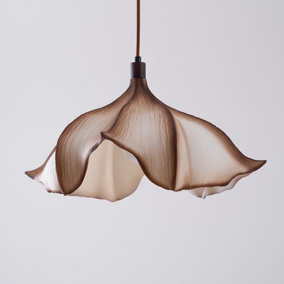 Another angle of the pendant light in a living room setting.