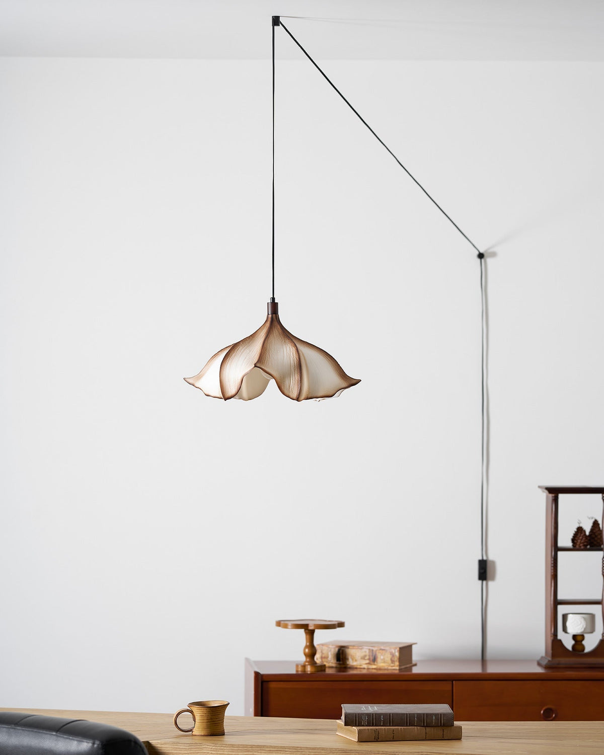 The Viscontea light shown against a dark wall for contrast.