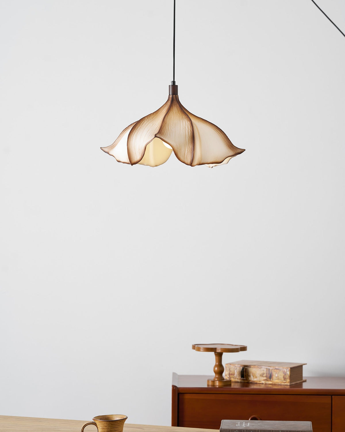 The light fixture unlit, showing the white and brown finish details.