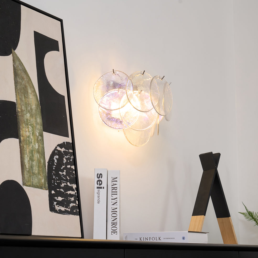 Angled view of the pink Vistosi Disc Wall Lamp.