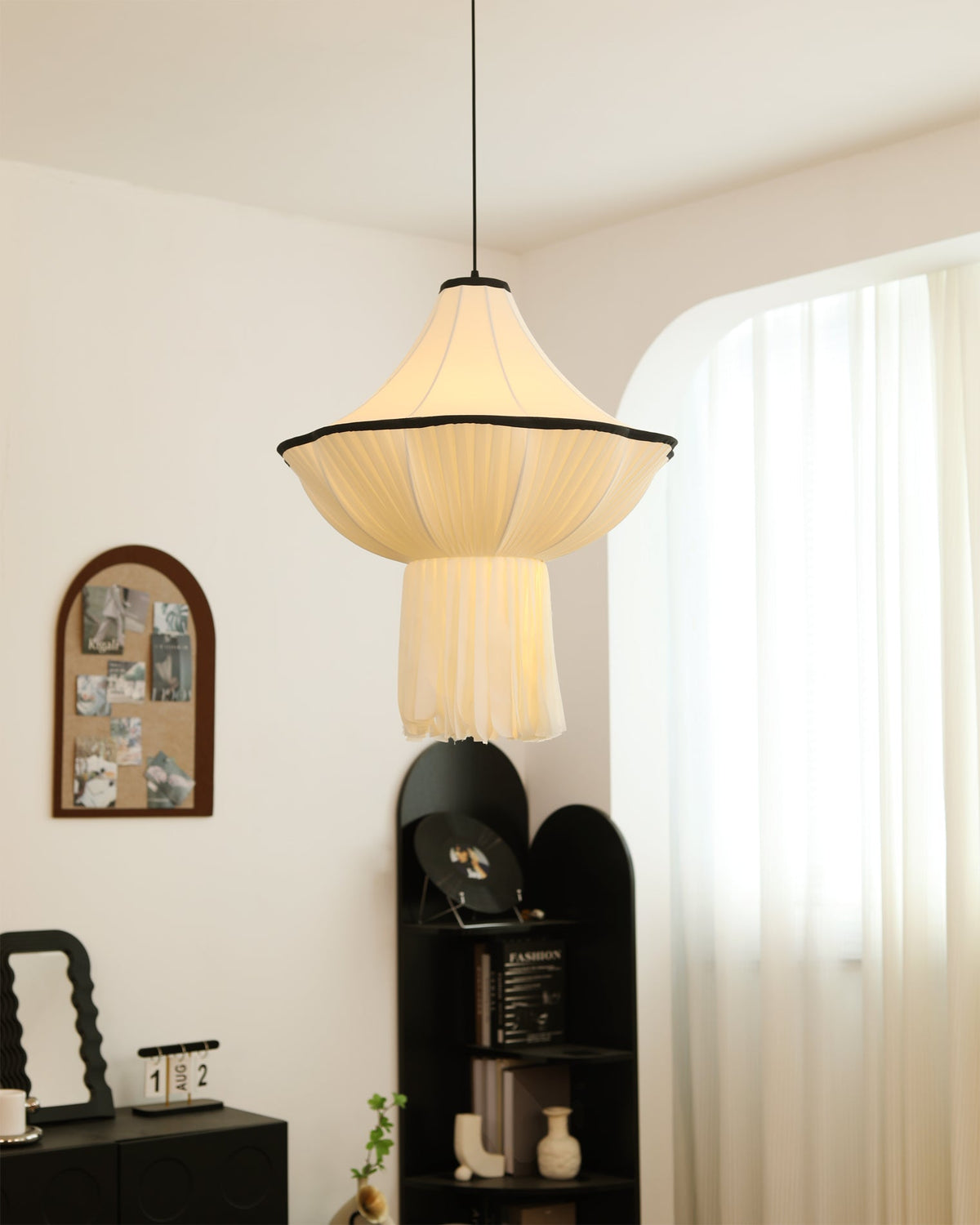The Wildon Pendant Light providing warm, ambient light over a dining table.