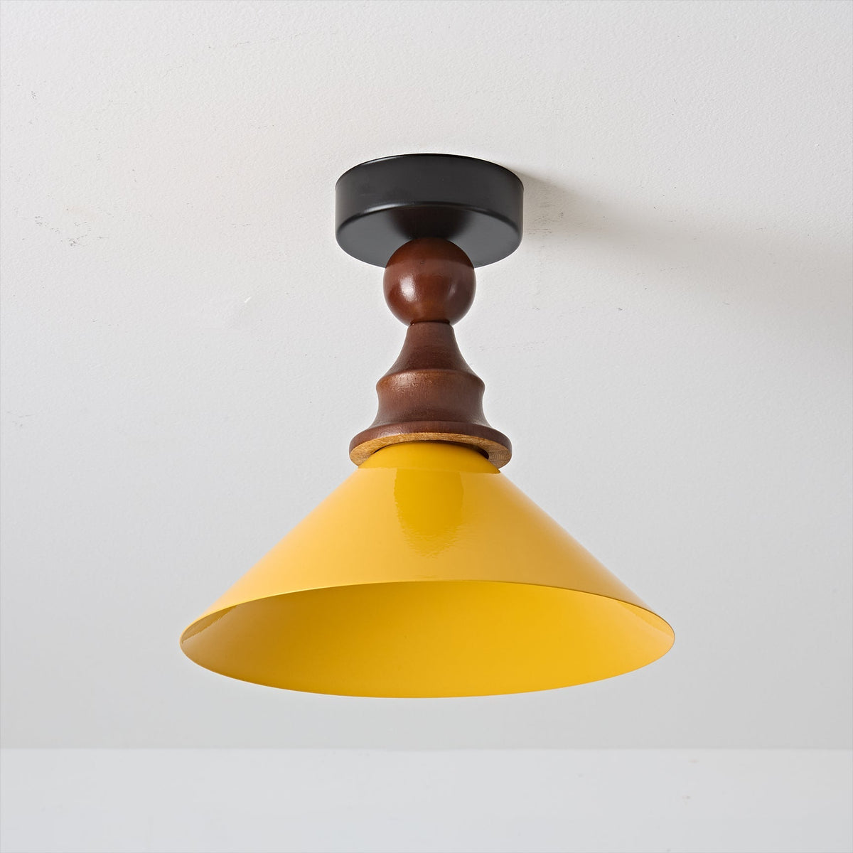 Wilken Ceiling Lamp illuminated, casting a warm light.
