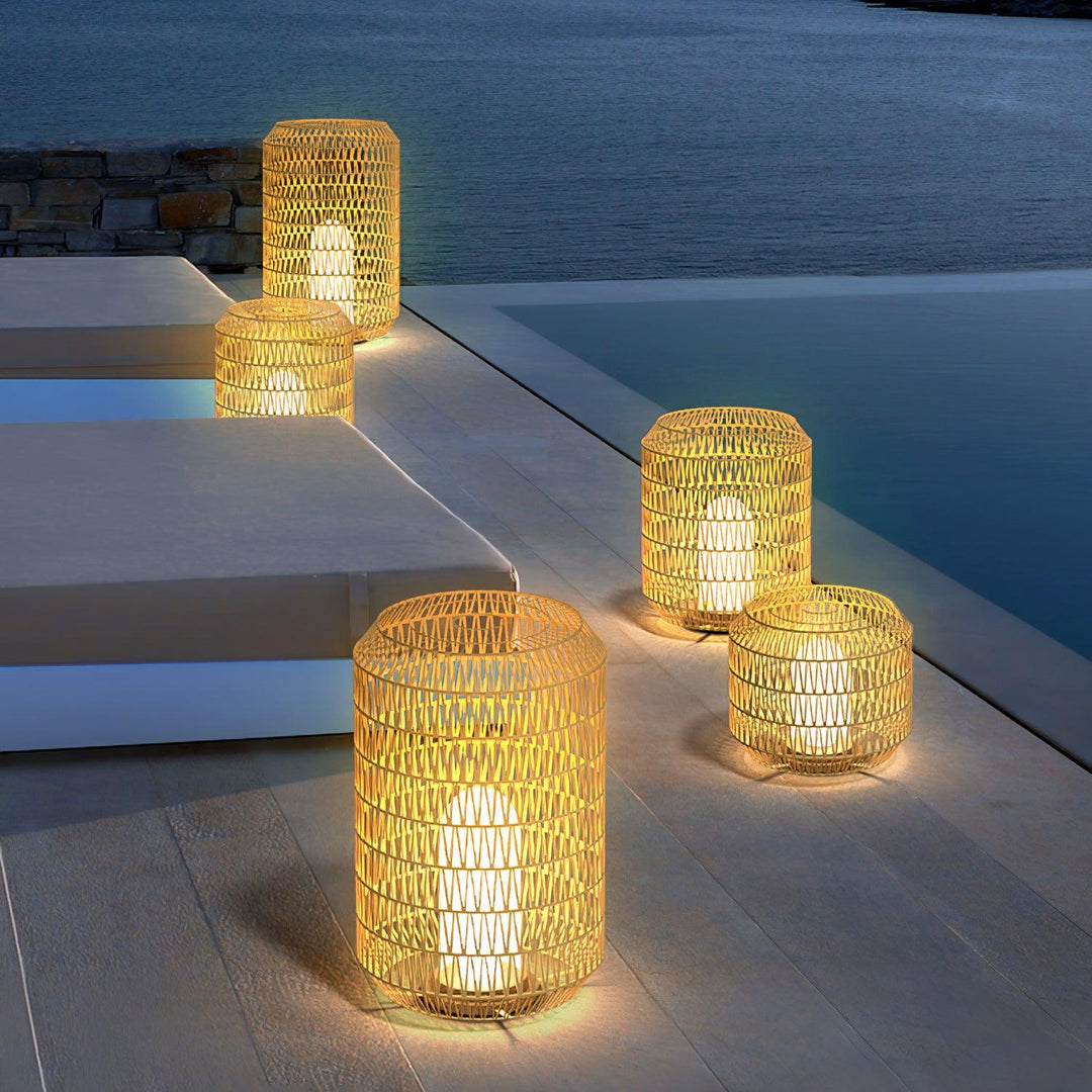 Woven rattan lamp styled on a modern outdoor deck.