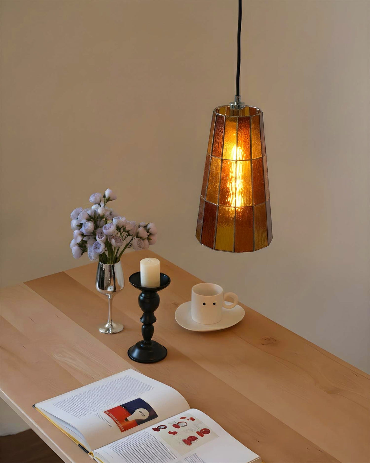 The Zola Glass Pendant Lamp in an amber finish.