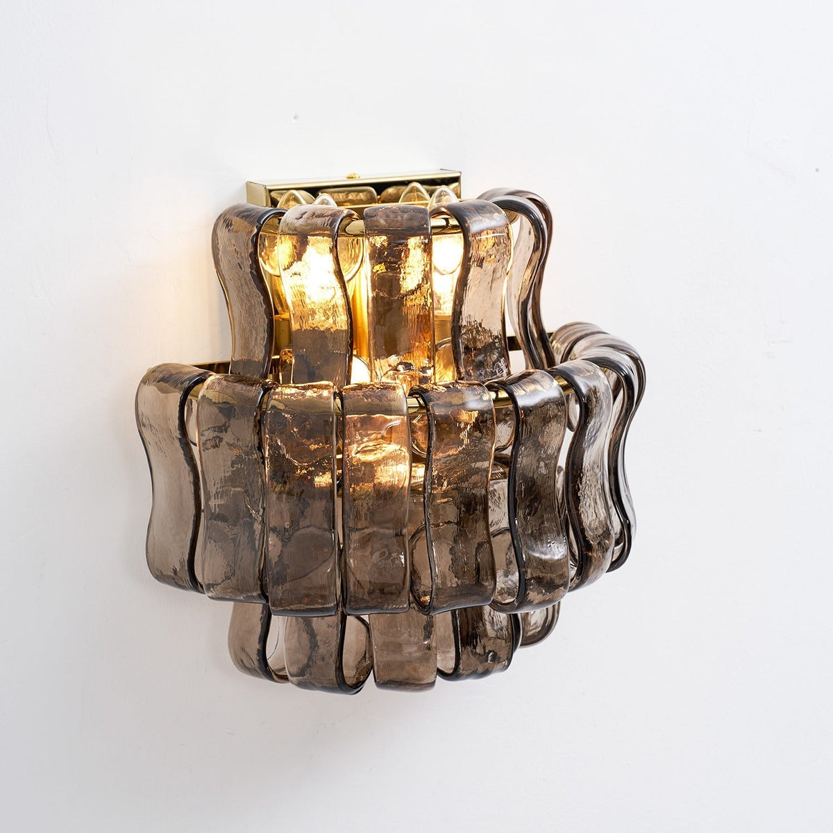 The light pattern cast by the ribbed glass of the Albano Wall Lamp.