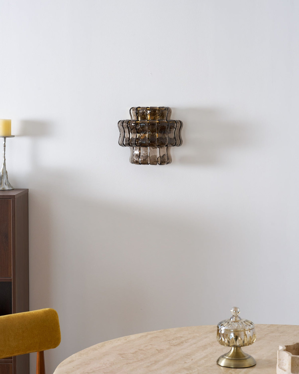 Angled shot of the green glass Albano Wall Lamp.