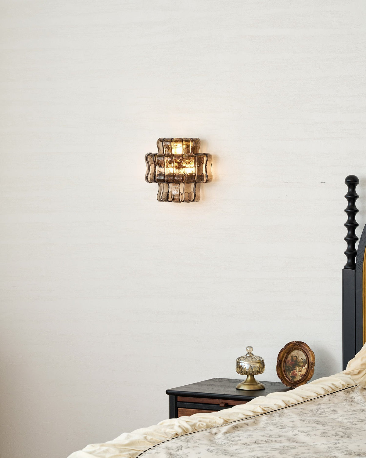 Angled shot of the gold glass Albano Wall Lamp.