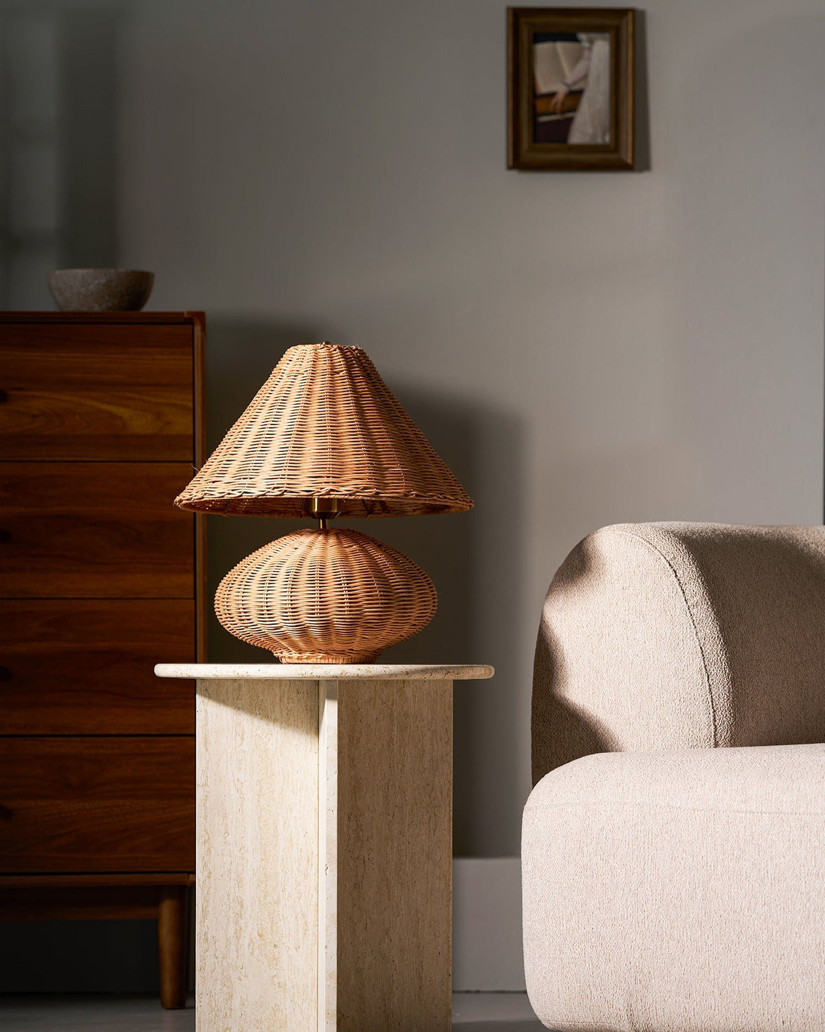 The in-line push-button switch on the lamp's black cord.