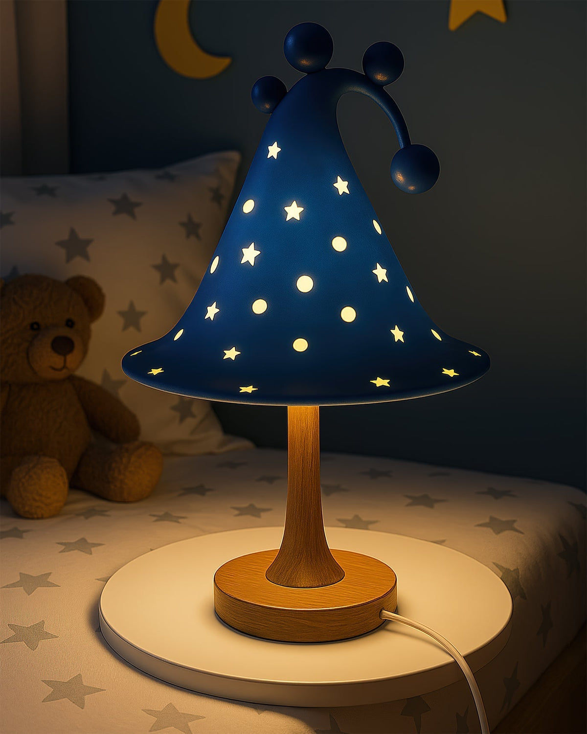 Close-up of the green resin wizard hat lamp, showing star details.