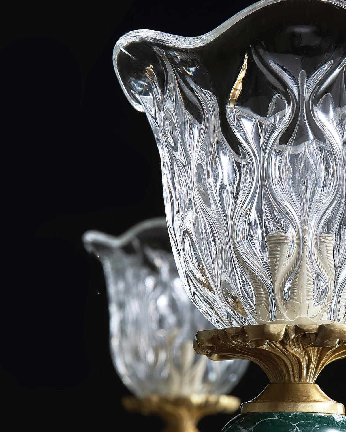 Detail of the glass shade and bulb fixture on the Dieppe Chandelier.