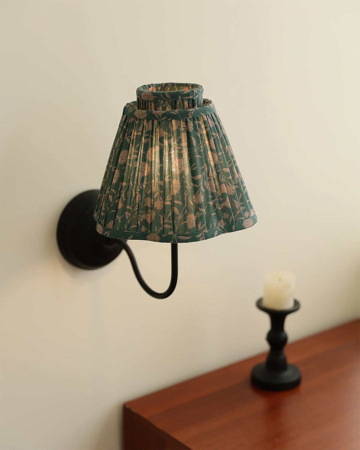 Angled view of the light brown and black version of the Elbow Wall Light.