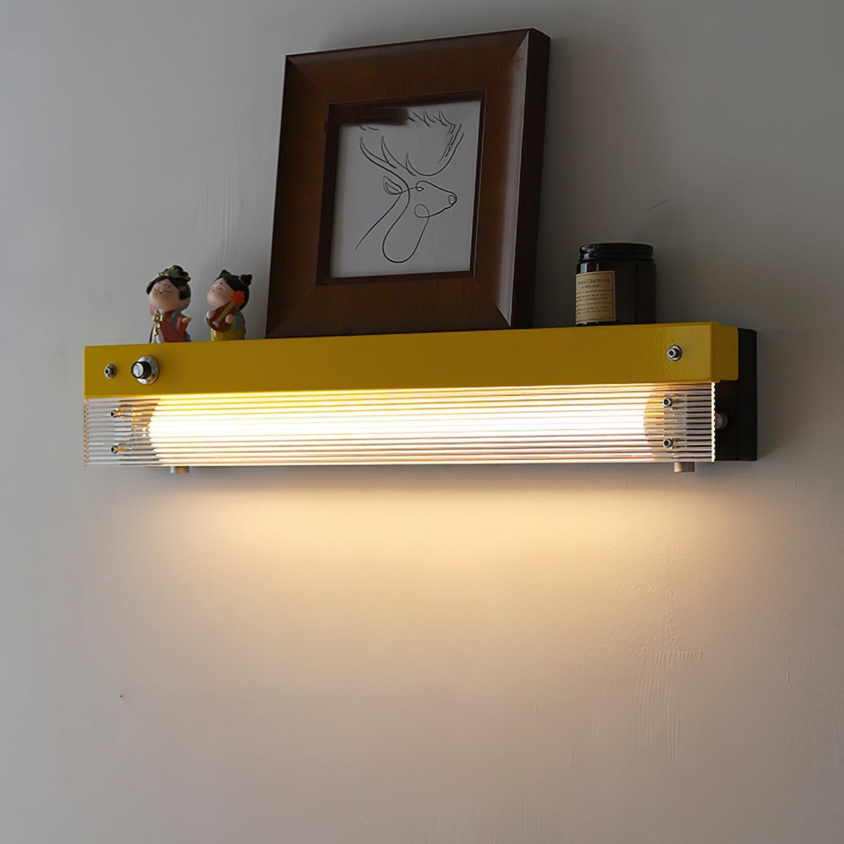 Side profile of the orange Totem Wall Lamp.